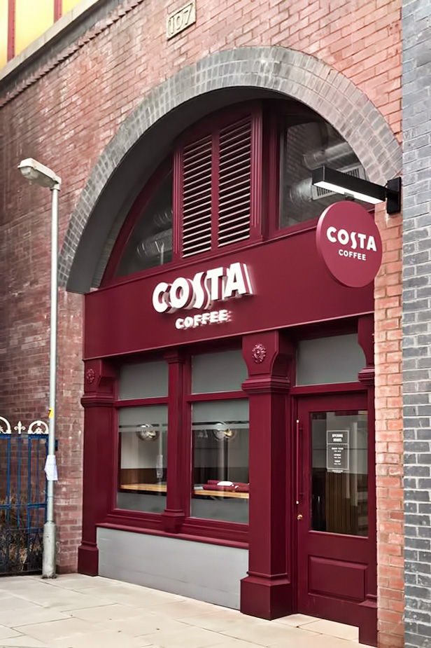 Costa Coffee film set signage on the cobbles in Manchester's iconic soap