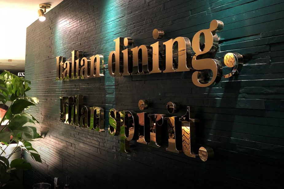 Polished brass built up letters for restaurant chain Prezzo